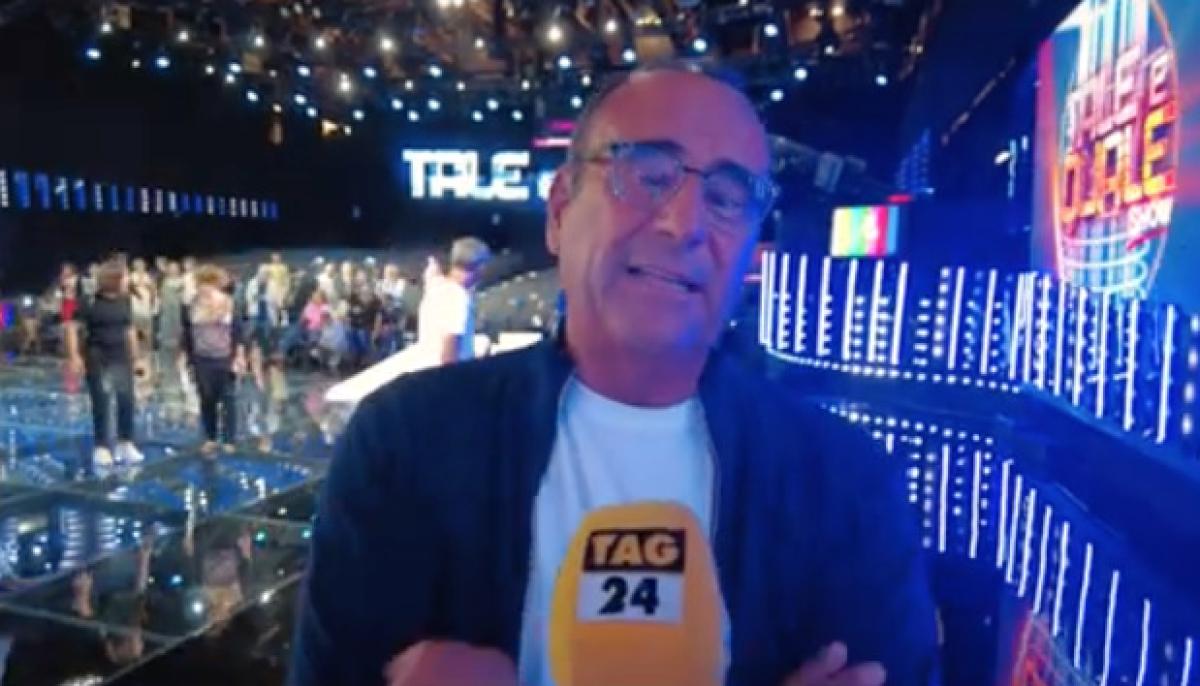 Carlo Conti torna con “Tale e Quale” e commenta lo spostamento del GF: “Sarà comunque difficile fare ascolti alti” | VIDEO ESCLUSIVA